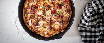 Cast Iron Skillet Pizza with Spicy Sausage and Pickled Onions